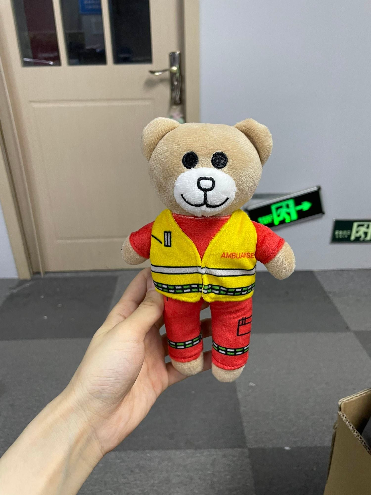 Ambulansebamsen — custom teddy bear in ambulance uniform with AMBULANSE vest